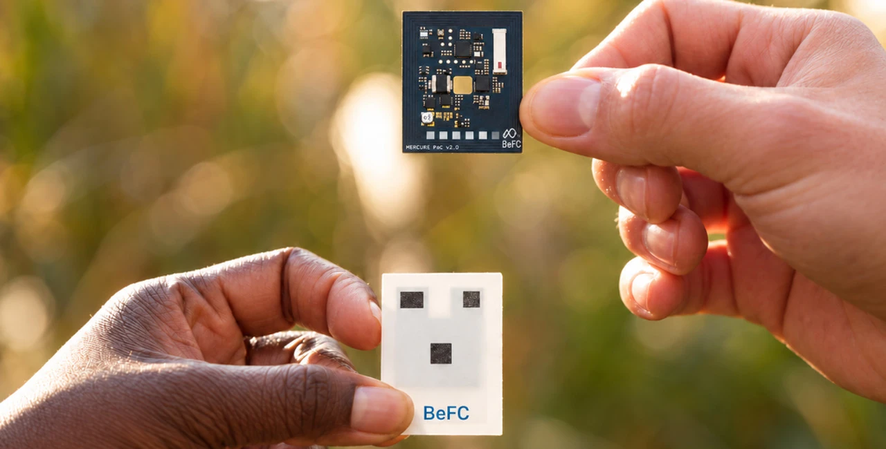 Brochure image showing electronics and a thin BeFC biofuel cell held in two hands