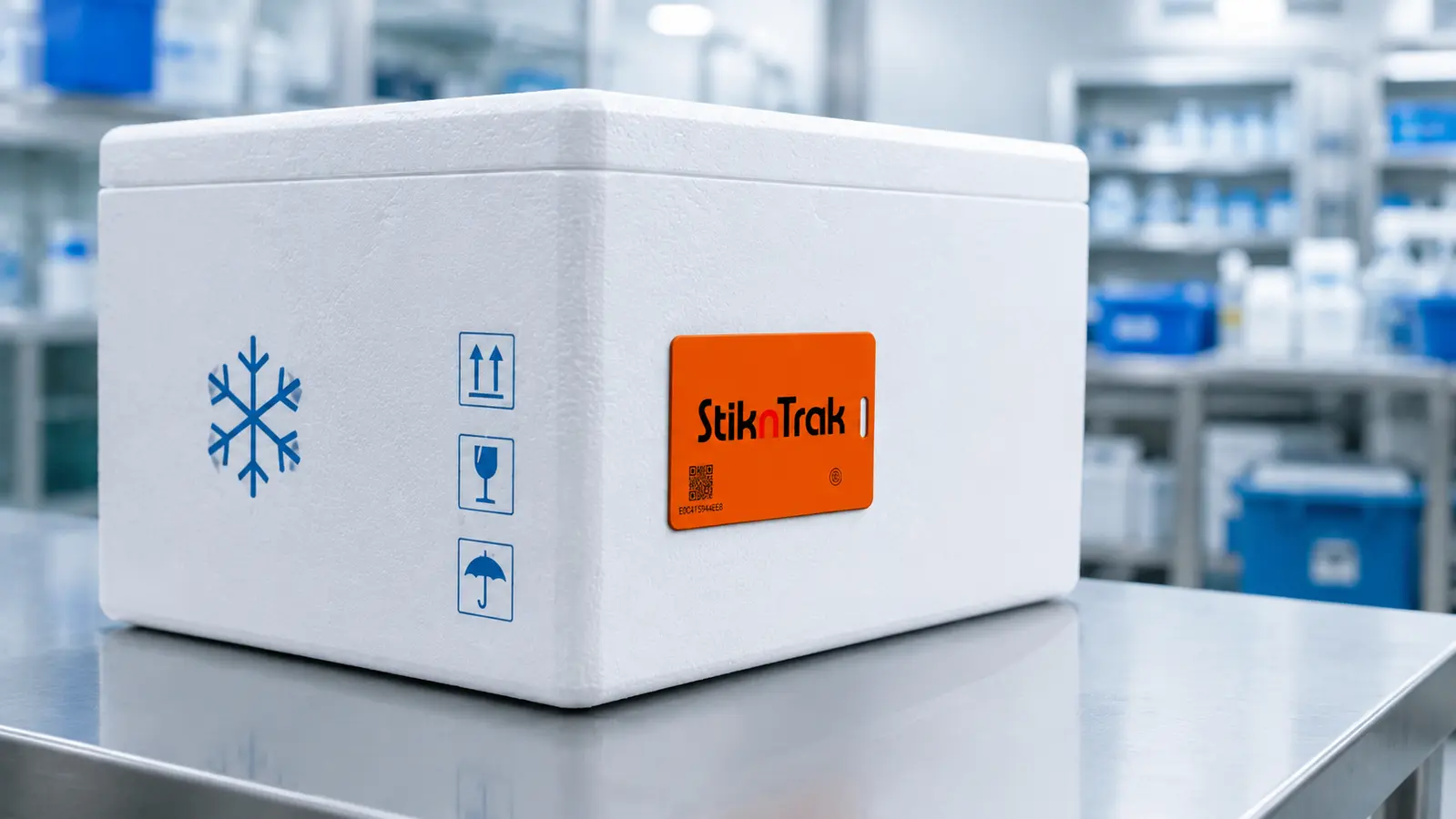 Illustrative application showing the orange StiknTrak SNT-FM36 attached to a white insulated pharmaceutical shipment box